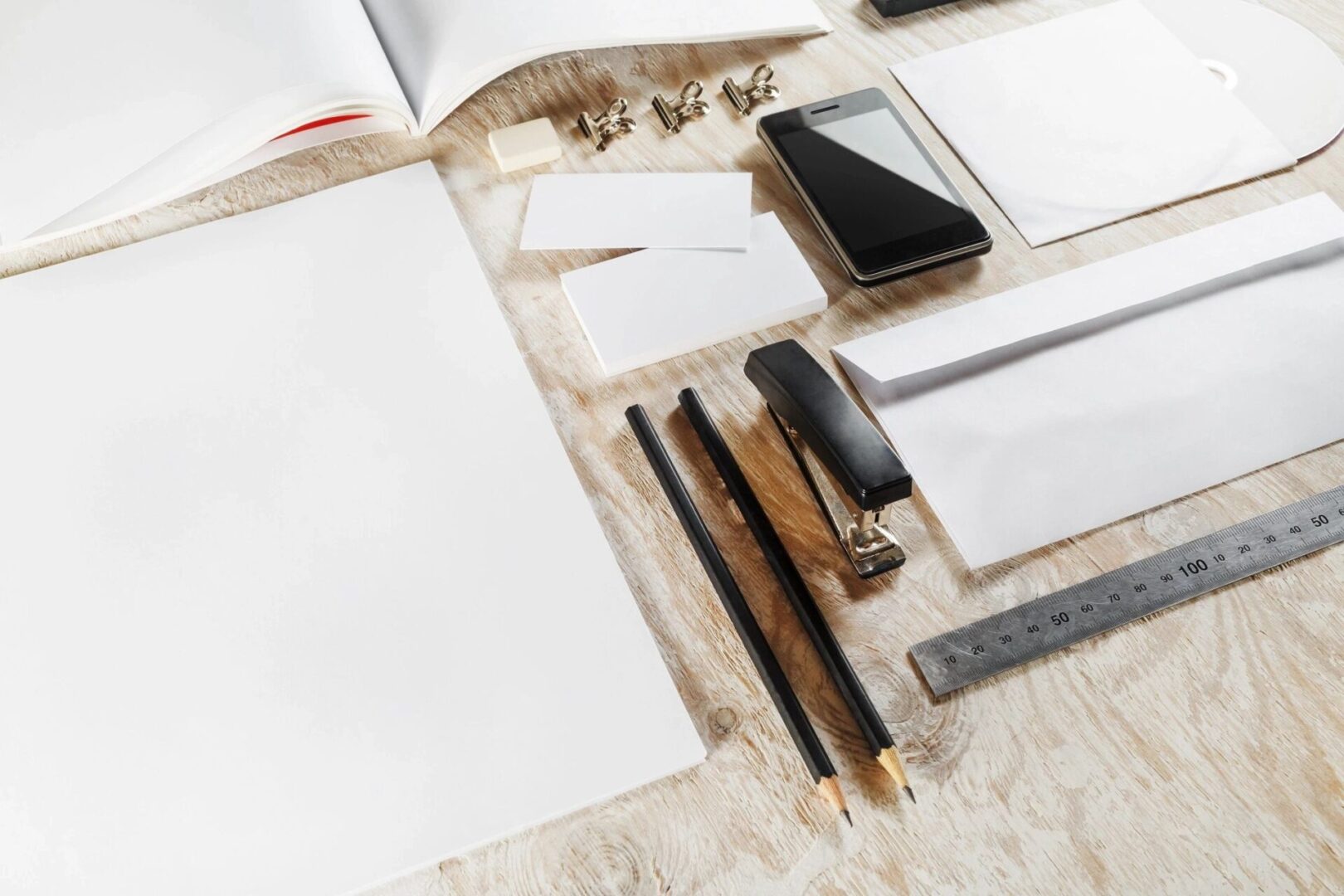 A table with some papers and pencils on it